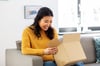 Woman opening a package