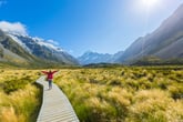 Hiker on a boardwalk in Aoraki/Mount Cook National Park in New Zealand