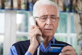 Senior Man Giving Credit Card