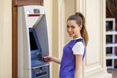 Woman using an automated teller