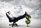 Man lounging in chair with feet on dollar sign