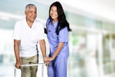 Senior health care pictured by a man with a walker and a nurse