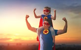 Father and daughter dressed as super heroes