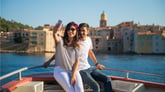 Couple taking a selfie on a boat in Saint-Tropez, France