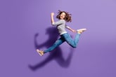 Woman jumping in air.