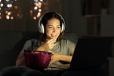 Woman watching movie on her computer