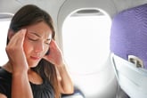 Unhappy woman on a plane