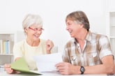 retired couple reviewing tax documents