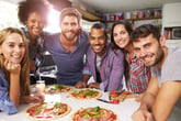 A group of friends with pizza