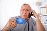 Elder Senior Man Credit Card Landline Phone