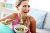 Woman eating healthful food