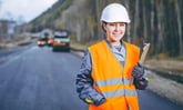 Worker on the road in a construction hat