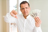 Angry man with money