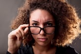 Skeptical woman in eyeglasses