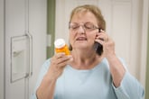 Woman with prescription drug bottle