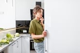 Woman looking into her fridge