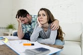 Sad couple with debt