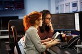 Two female web developers at a computer
