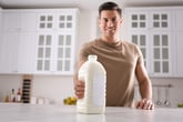 Man with a gallon of milk