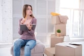 Young woman renter packing up to move house