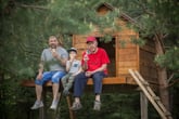 A son, father and grandfather in a treehouse.