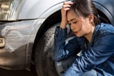 Woman stressed about a car crash or accident