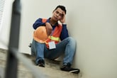 Tired construction worker