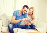 Happy couple with mortgage calculator