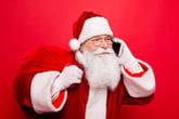 Santa talking on his smartphone