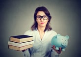 Young woman considering student loans for college savings