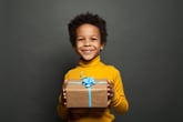 Child holding a holiday gift