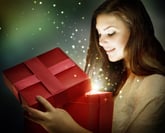 A woman opens a magical holiday gift