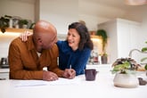 Senior couple signing mortgage paperwork