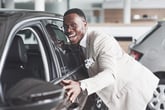 Happy man buying car