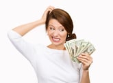 Confused woman holding cash
