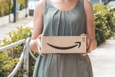 Woman holding an Amazon package