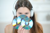 Woman holding compact discs