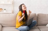 Excited woman shopping online