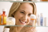 Woman with prescription drug bottle