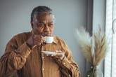 Relaxed senior sipping tea and thinking about retirement