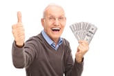 senior man holding money