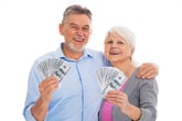 Senior couple holding money