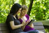 Woman using a tablet outdoors