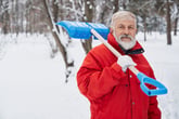 Man holding a snow shovel