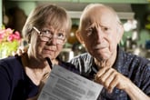 Senior couple upset and worried about medical bills