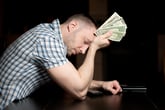 Worried man with money