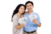 Couple holding cash
