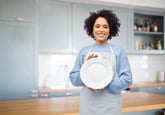 Woman holding a clean plate