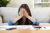 Frustrated woman looking at her bills
