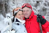 Happy retirees skiing